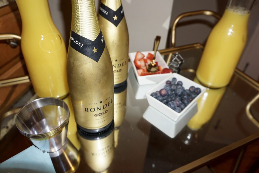 mimosa bar, strawberries, blue berries, orange juice, bar cart, champagne