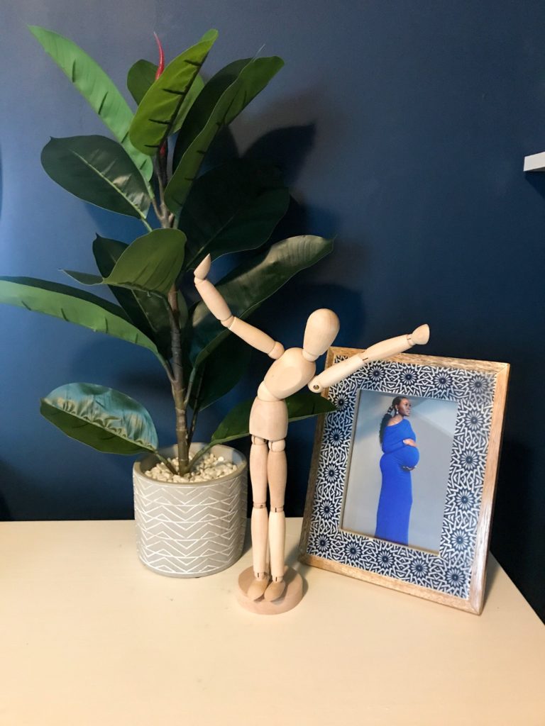 dark blue nursery, navy blue nursery, moody nursery, animal print, safari theme nursery, tribal nursery, lion rocker, tarva dresser, Ikea dresser hack, white crib, tiger print, elephant print, lion print, tribal rug, nursery books  