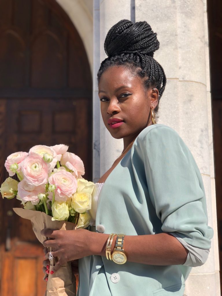 light green pant suit, leather converse, flowers, ranunculus, roses, marble steps