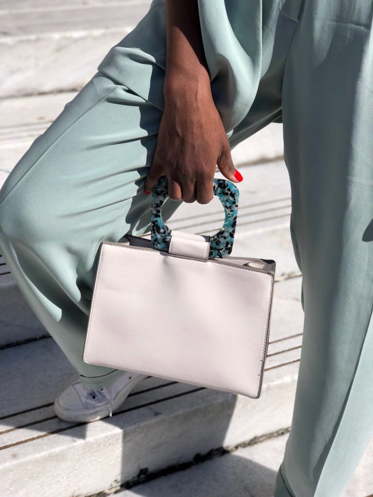 light green pant suit, leather converse, flowers, ranunculus, roses, marble steps