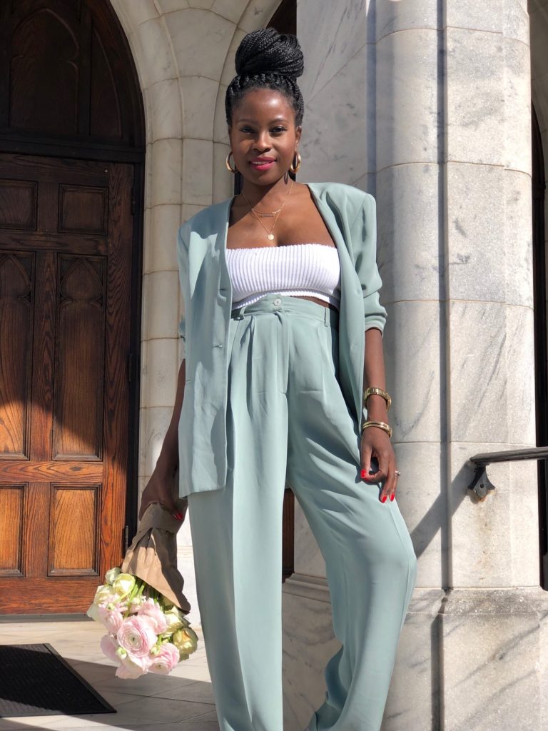 light green pant suit, leather converse, flowers, ranunculus, roses, marble steps