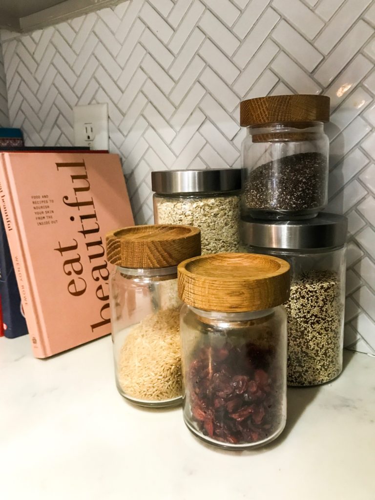 superfoods, wood glass jar, quinoa, oatmeal, chia seeds, dried cranberries, brown rice, eat beautiful book, herringbone tile, breastfeeding 